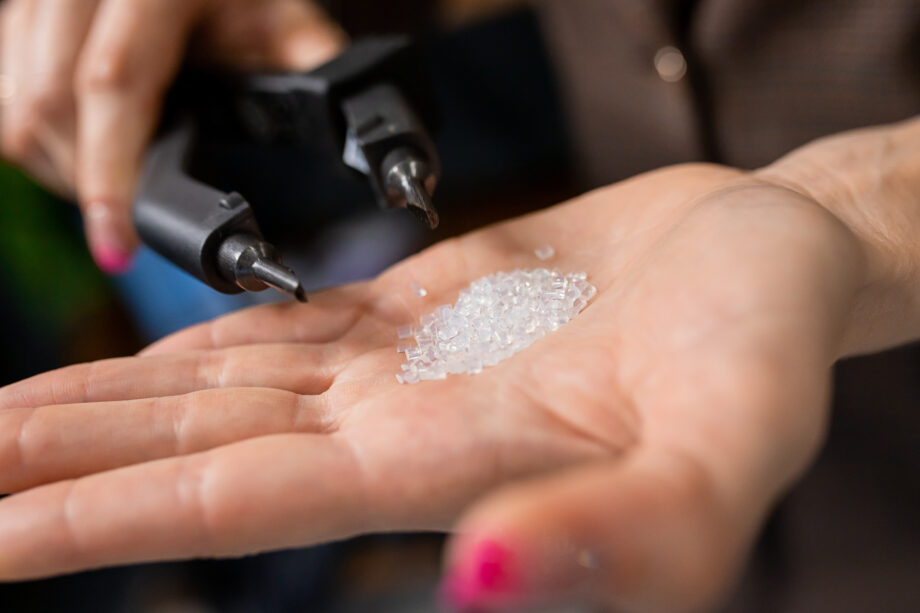 a person holding a handful of crystals